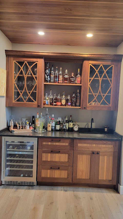 Walnut Bar(1) A bar with some bottles and wine glasses on it